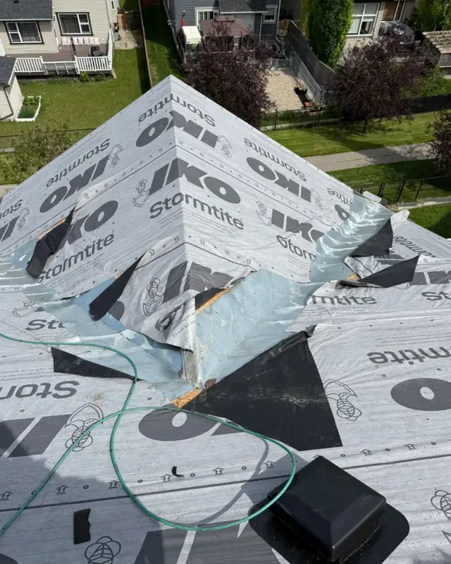 Before: the same roof with IKO synthetic underlayment and flashing going on