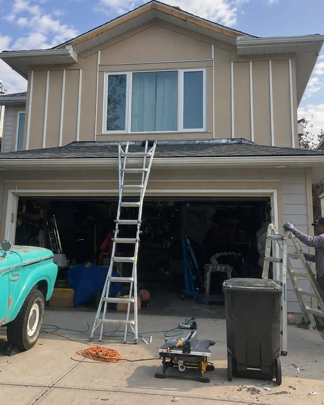 Before: the same home mid-renovation with ladder and open garage